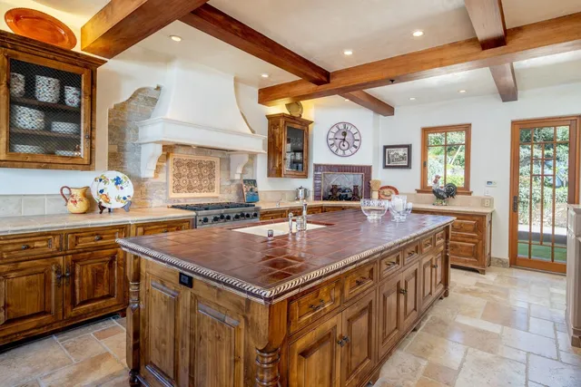 a kitchen with stainless steel appliances granite countertop a stove and a sink