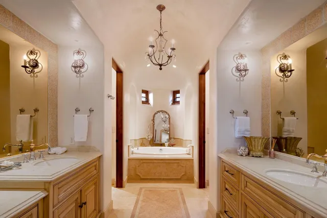 a bathroom with a double vanity sink mirror and double