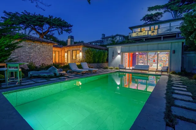 a view of swimming pool outdoor seating with a garden