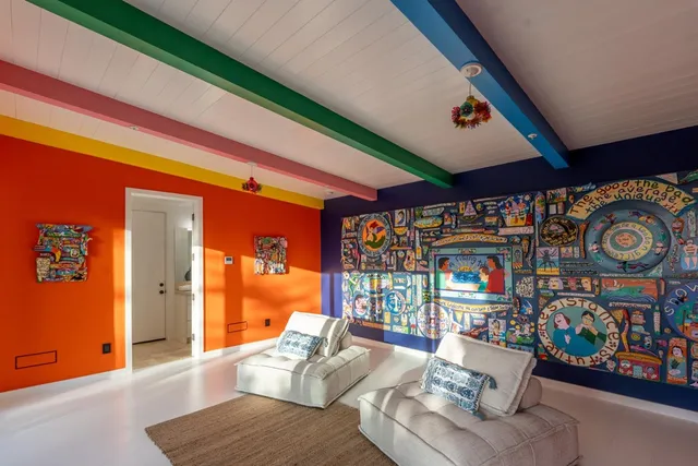 a living room with lots of furniture and a window