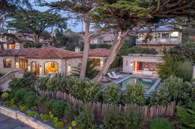 a front view of a residential apartment building with a yard