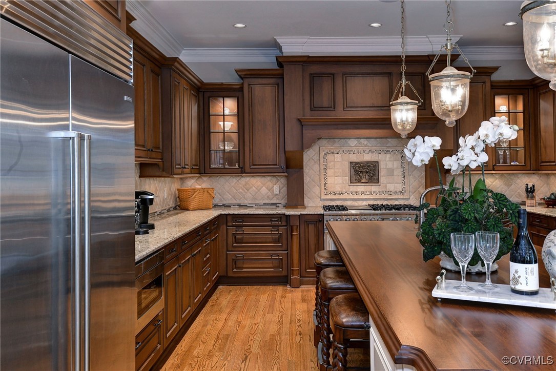 1220 Two Rivers Point Williamsburg, VA 23185 - Photo 16 of 50 a kitchen with counter top space cabinets and stainless steel appliances