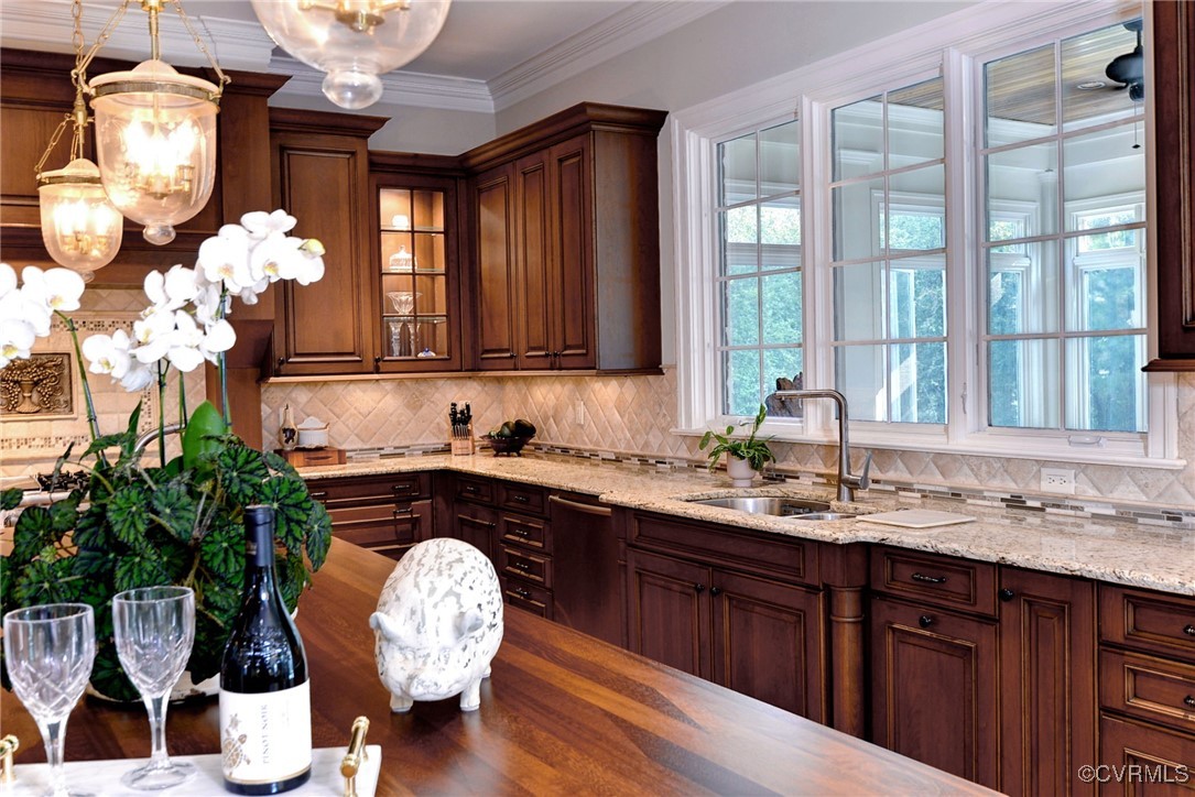1220 Two Rivers Point Williamsburg, VA 23185 - Photo 17 of 50 a kitchen with a chandelier a sink and cabinets