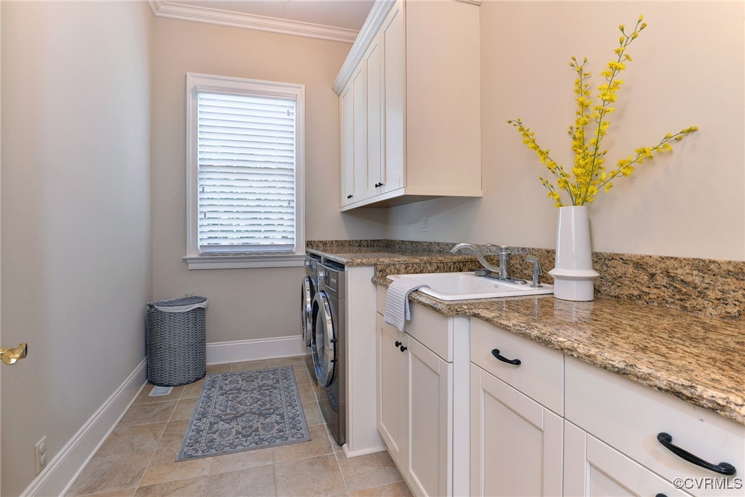 1220 Two Rivers Point Williamsburg, VA 23185 - Photo 20 of 50 a kitchen with a granite countertop sink and a white wooden cabinets