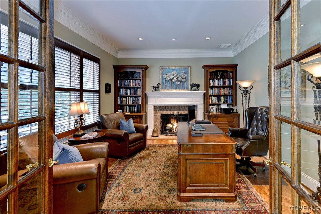 1220 Two Rivers Point Williamsburg, VA 23185 - Photo 21 of 50 a living room with furniture large window and a fireplace