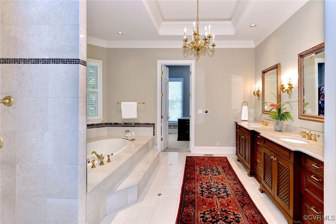 1220 Two Rivers Point Williamsburg, VA 23185 - Photo 25 of 50 a spacious bathroom with a double vanity sink a large mirror and a bathtub