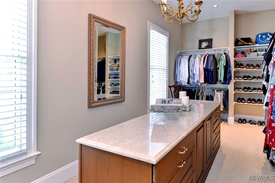 1220 Two Rivers Point Williamsburg, VA 23185 - Photo 28 of 50 a kitchen with stainless steel appliances granite countertop a sink dishwasher and a stove with wooden floor