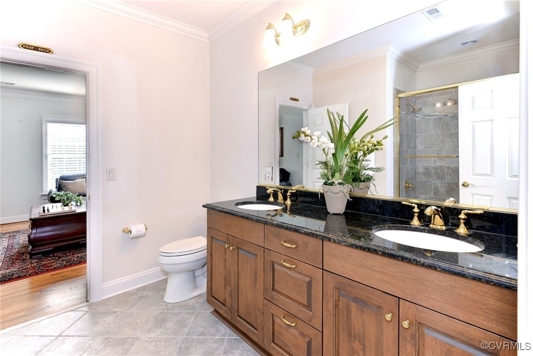 1220 Two Rivers Point Williamsburg, VA 23185 - Photo 32 of 50 a bathroom with double vanity a toilet a and a large mirror