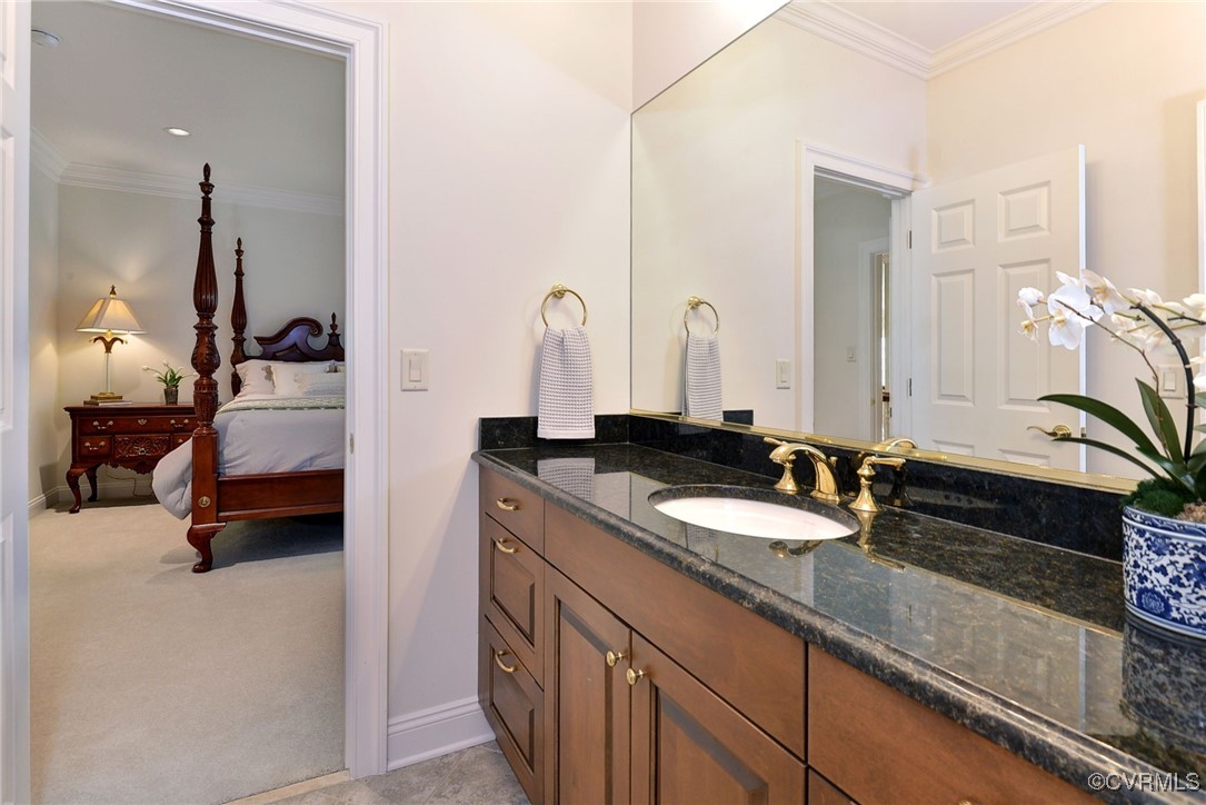 1220 Two Rivers Point Williamsburg, VA 23185 - Photo 37 of 50 a en suite bathroom with a double vanity sink and a mirror