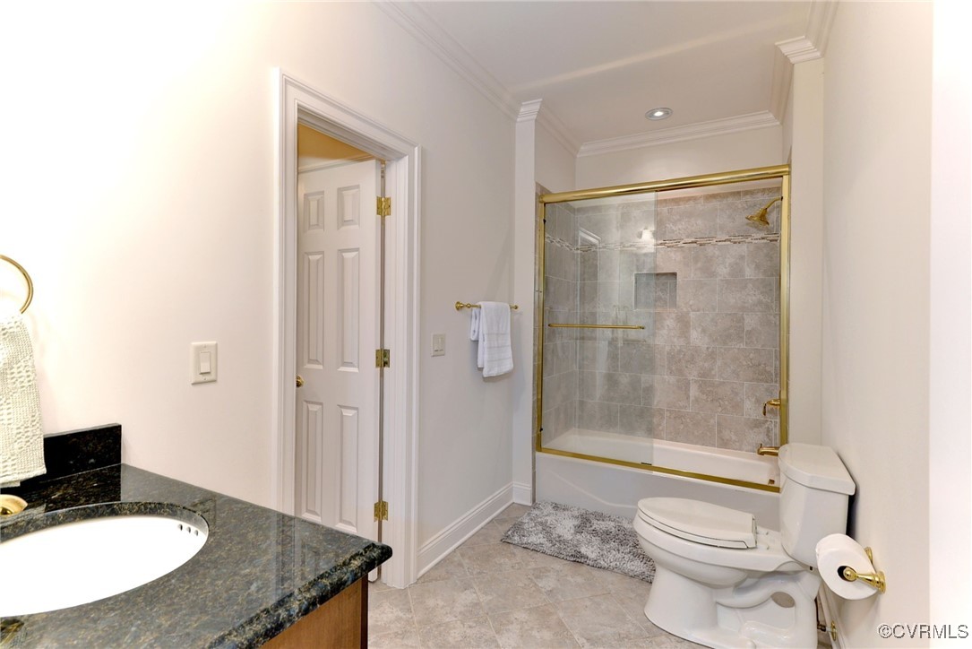 1220 Two Rivers Point Williamsburg, VA 23185 - Photo 38 of 50 a bathroom with a granite countertop toilet a sink and a mirror