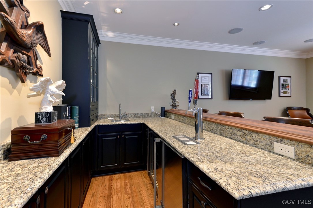 1220 Two Rivers Point Williamsburg, VA 23185 - Photo 41 of 50 a kitchen with granite countertop kitchen island a sink counter top space and stainless steel appliances