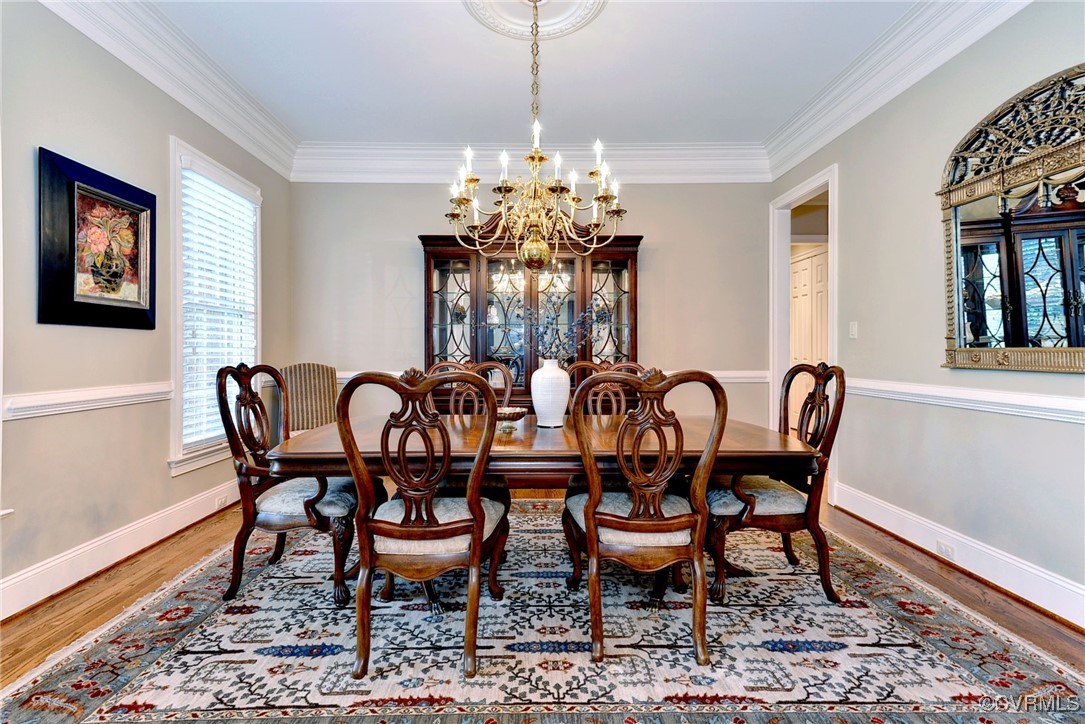 1220 Two Rivers Point Williamsburg, VA 23185 - Photo 8 of 50 a dining room with furniture a rug and wooden floor