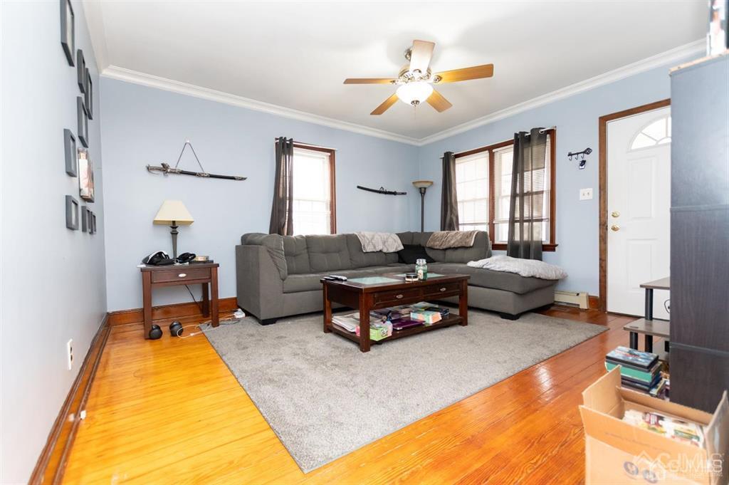405 Fulton Street Middlesex, NJ 08846 - Photo 6 of 13 a living room with furniture and a chandelier