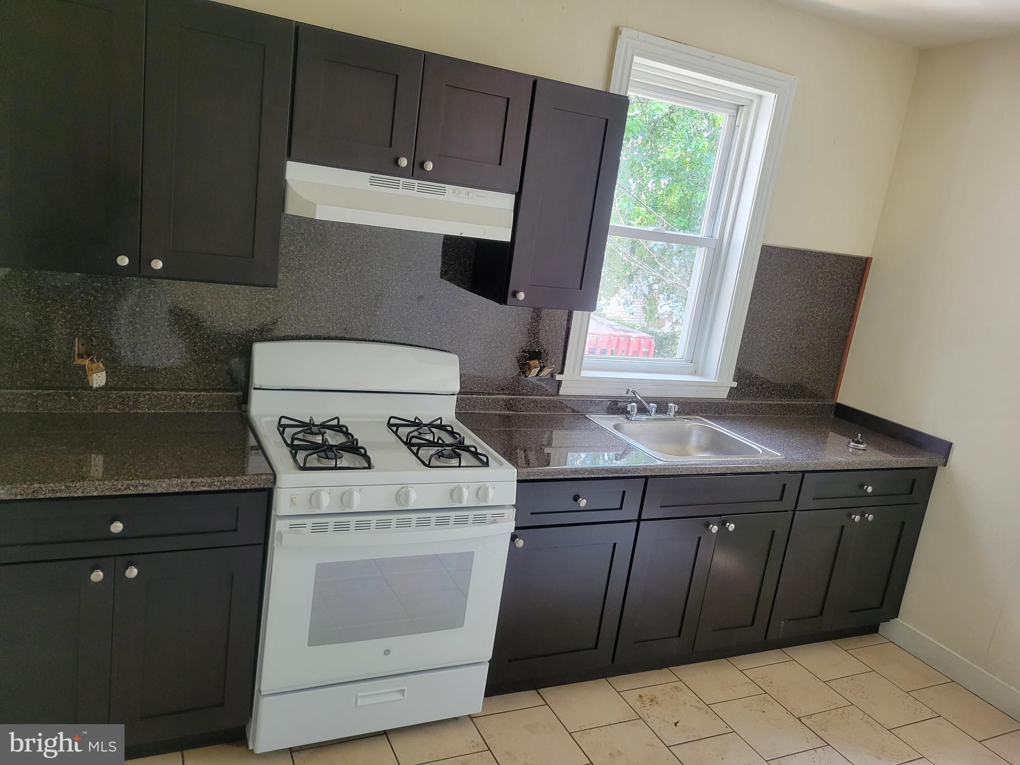 430 High Street Philadelphia, PA 19144 - Photo 2 of 5 a stove top oven sitting inside of a kitchen