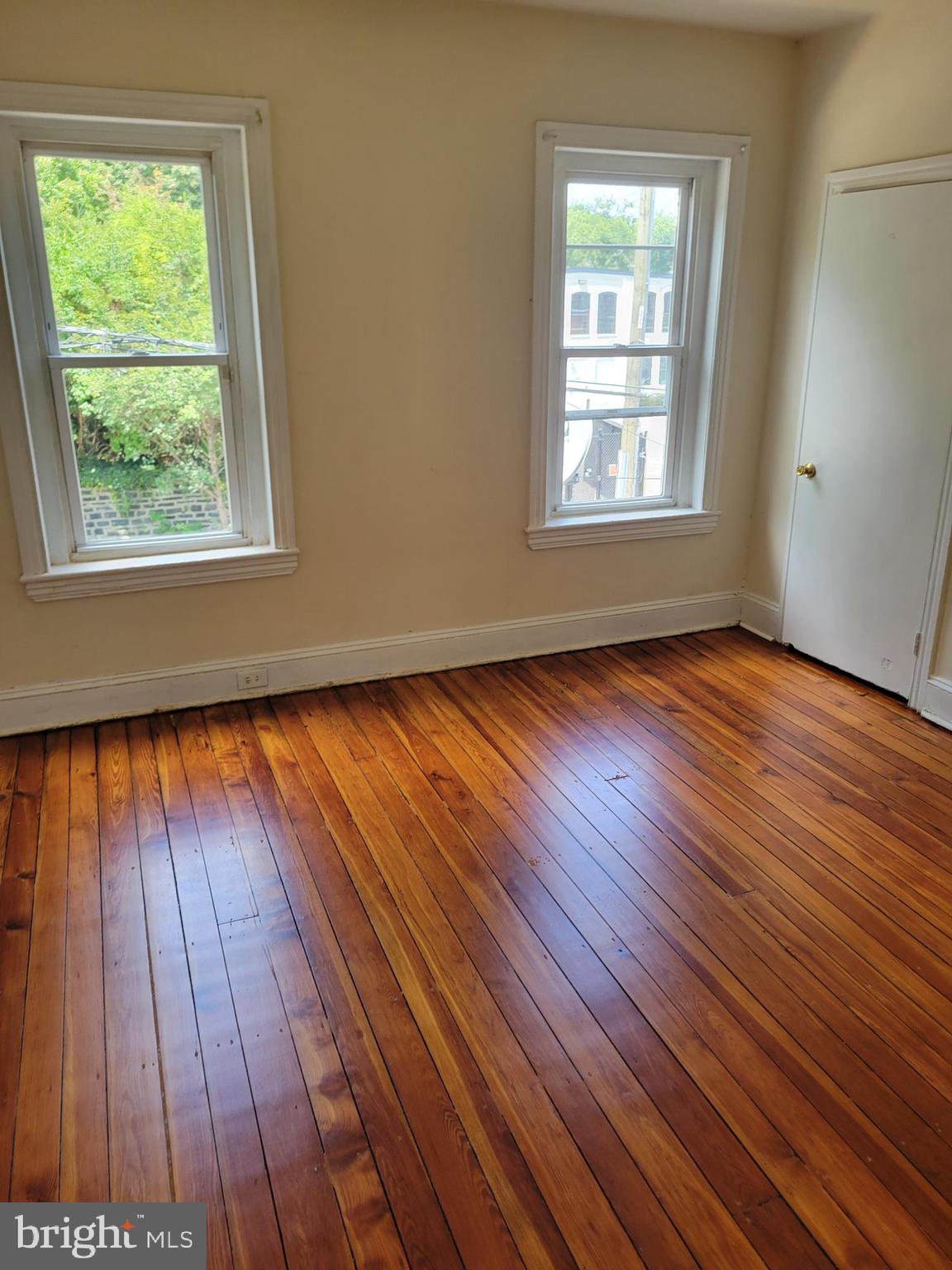 430 High Street Philadelphia, PA 19144 - Photo 3 of 5 a view of an empty room with wooden floor and a window