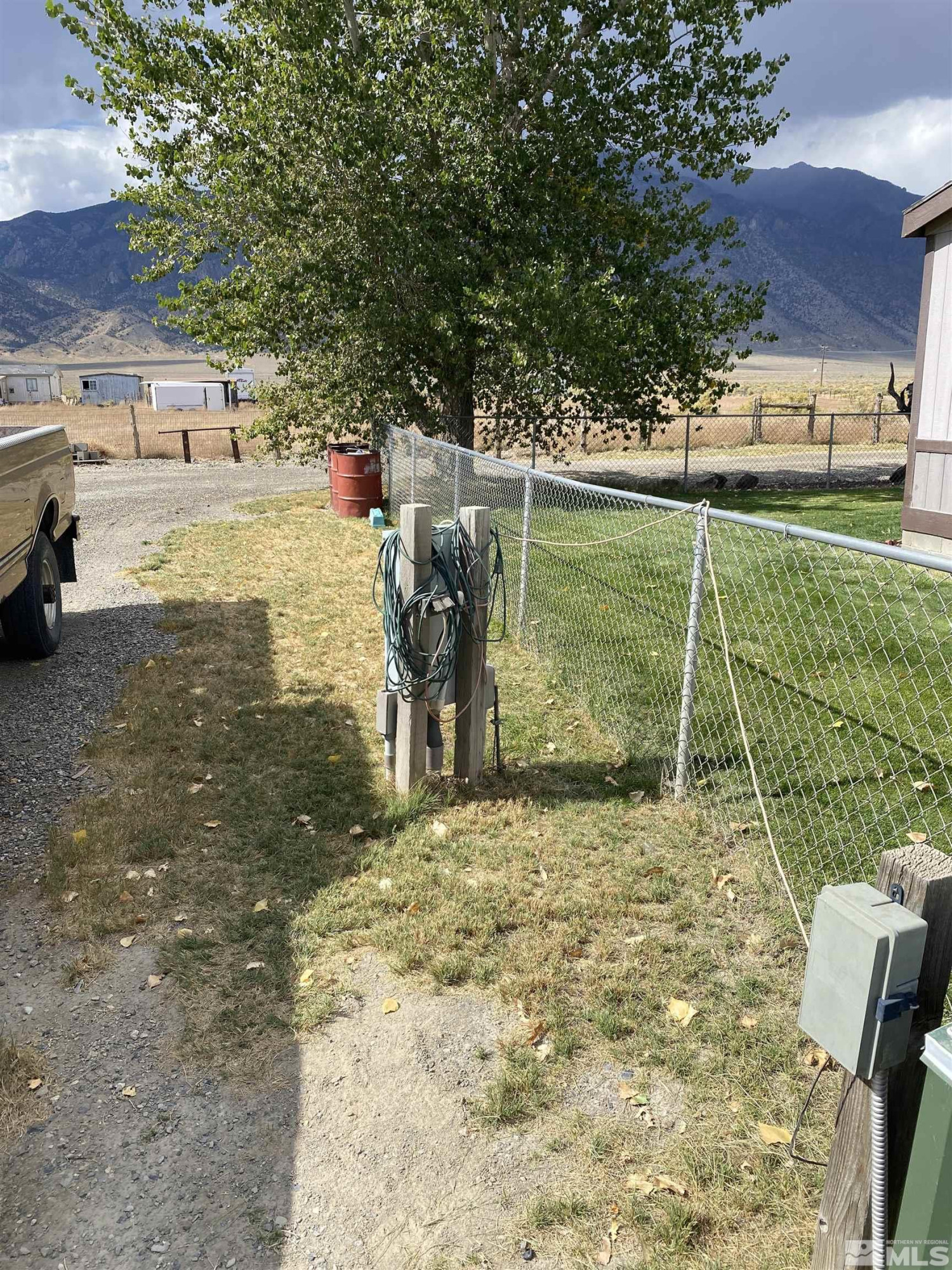 451 Manley Ranch Road Round Mountain, NV 89045 - Photo 20 of 40 a view of a yard with a table and chairs