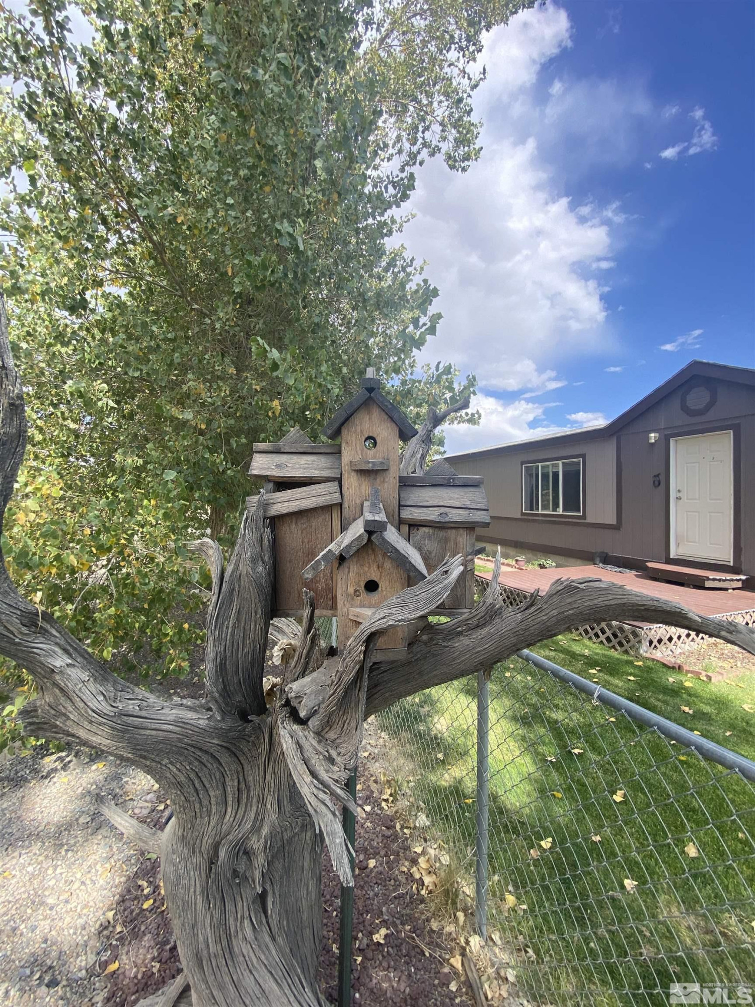 451 Manley Ranch Road Round Mountain, NV 89045 - Photo 5 of 40 a front view of a house with a yard