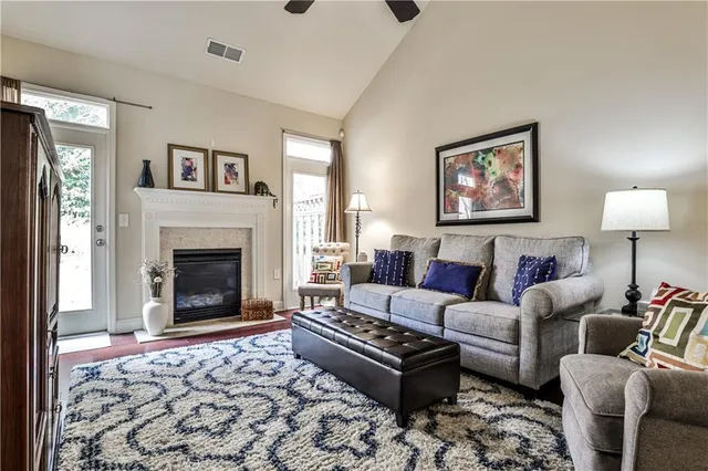 a living room with furniture and a fireplace