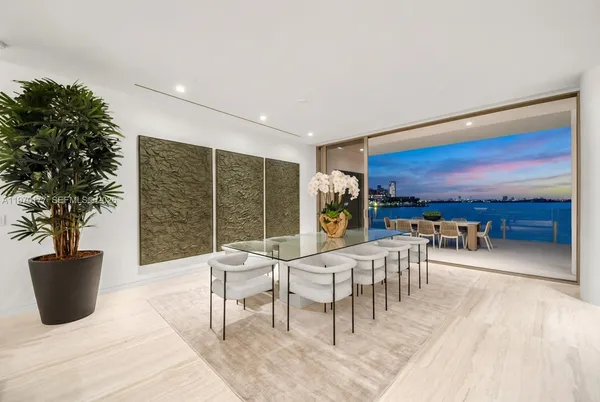 a view of a patio with a dining table and chairs