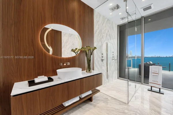 a bathroom with a sink double vanity and a mirror