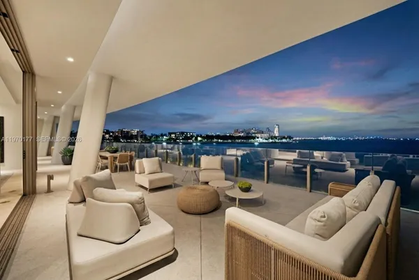 a living room with furniture and a city view