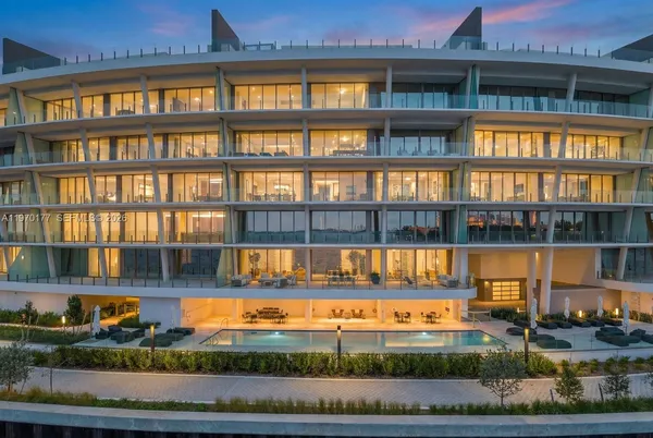 a view of swimming pool with an outdoor seating