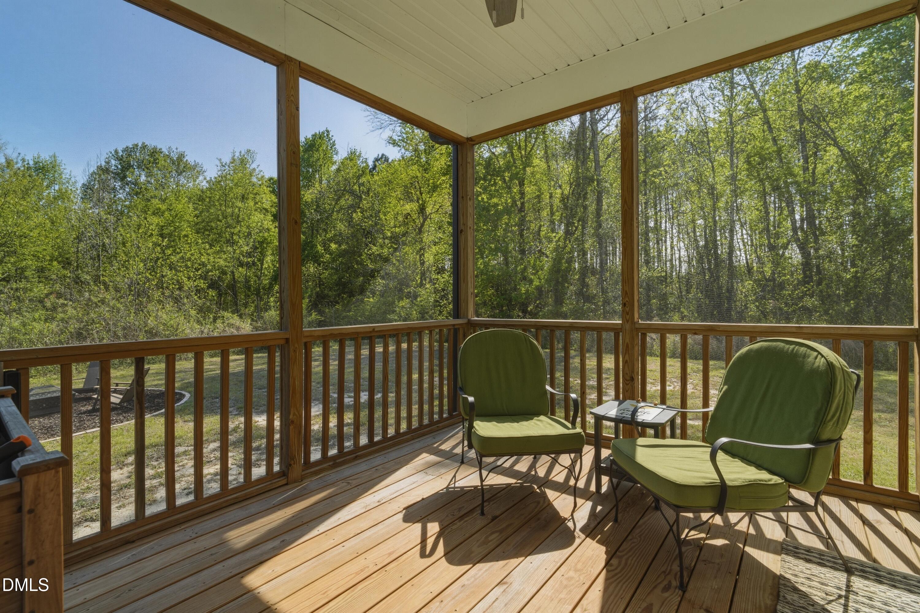 386 Howards Crossing Drive Wendell, NC 27591 - Photo 22 of 31 a view of a balcony with chairs and wooden floor