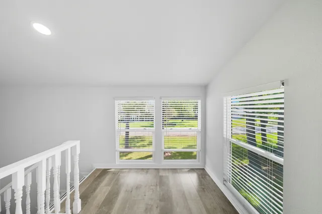 a view of a room with a large window