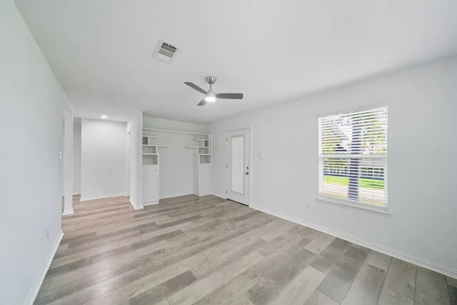 a view of an empty room with a window