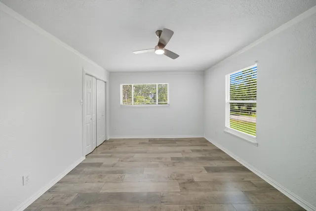 a view of an empty room with a window