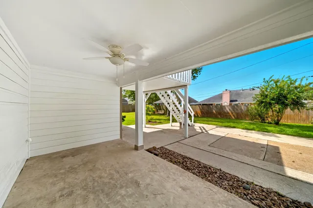 a view of a balcony with wooden floor