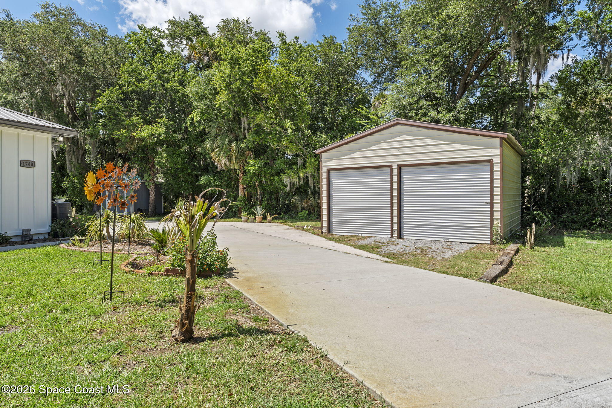 1740 Ford Road Mims, FL 32754 - Photo 41 of 43 a front view of a house with a yard