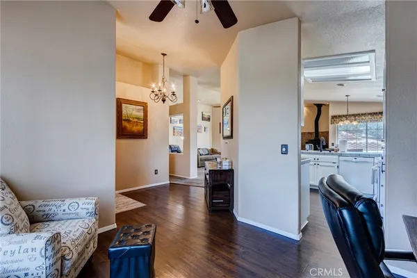 a kitchen with white cabinets and appliances