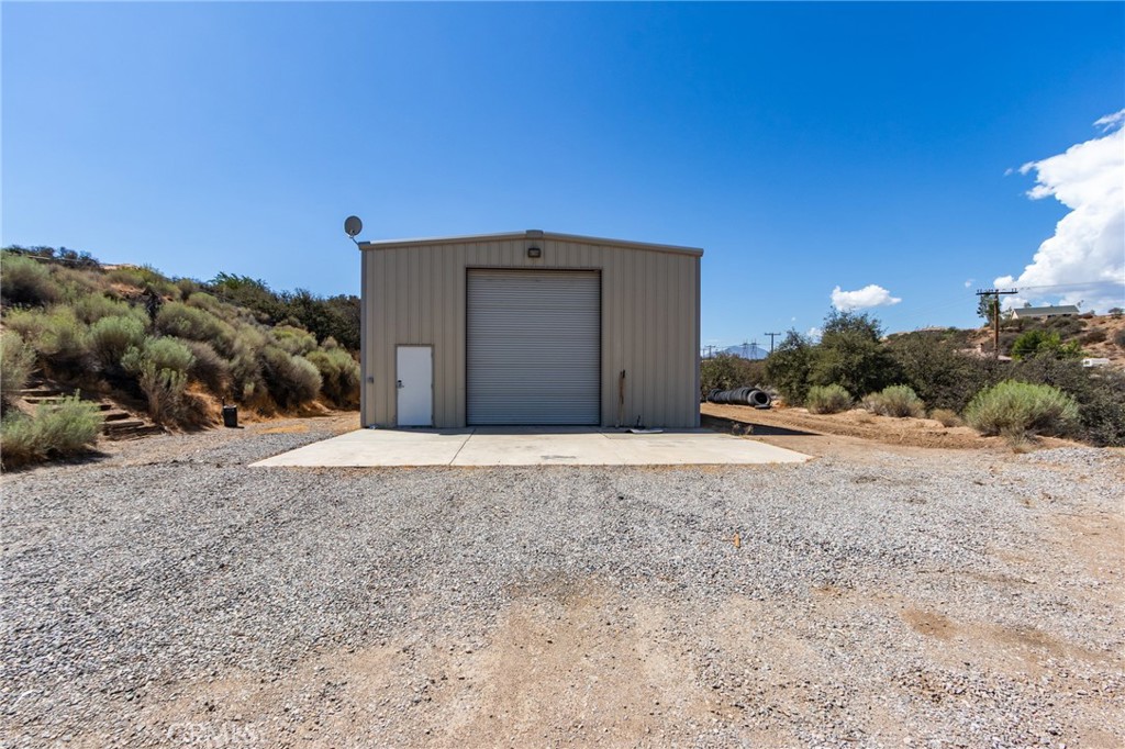 7170 Joshua Road Oak Hills, CA 92344 - Photo 2 of 58 a house with a yard