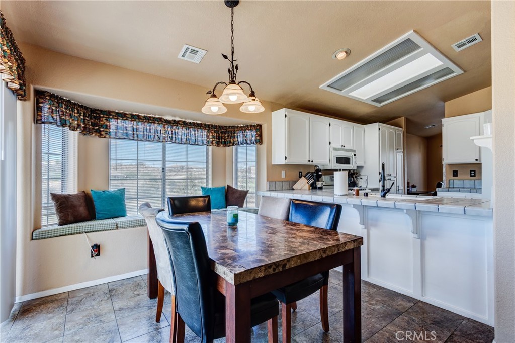 7170 Joshua Road Oak Hills, CA 92344 - Photo 26 of 58 a view of a dining room and livingroom view