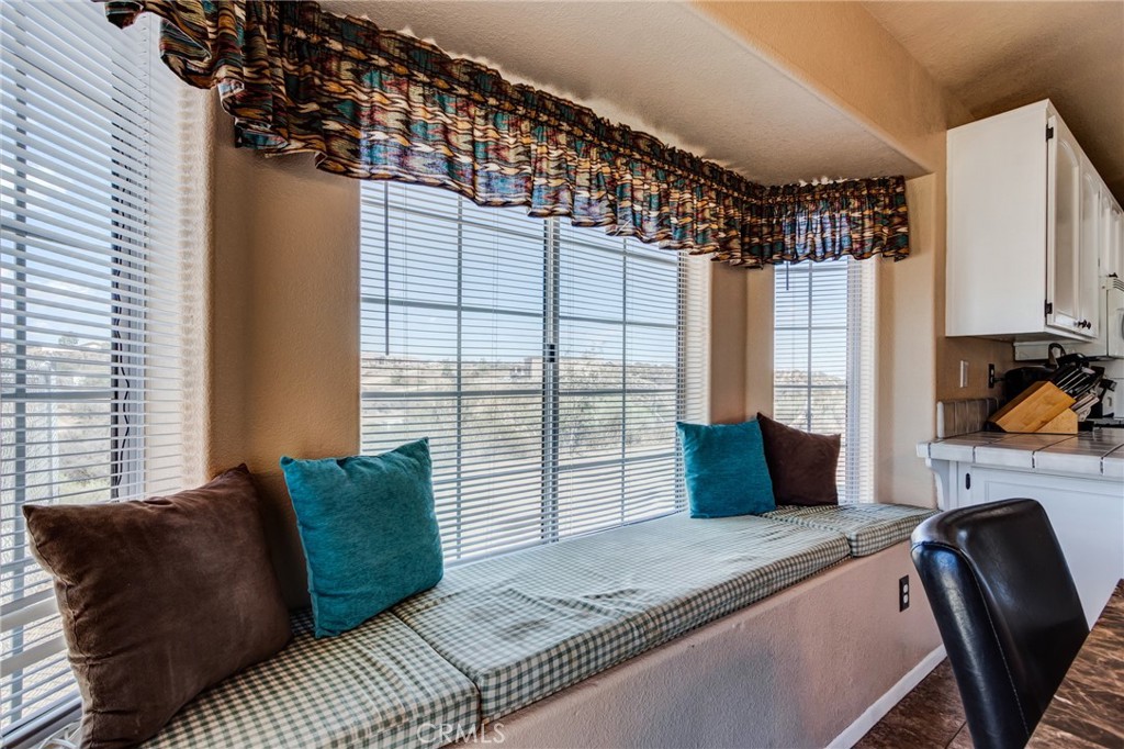 7170 Joshua Road Oak Hills, CA 92344 - Photo 27 of 58 a bedroom with a large bed and a window