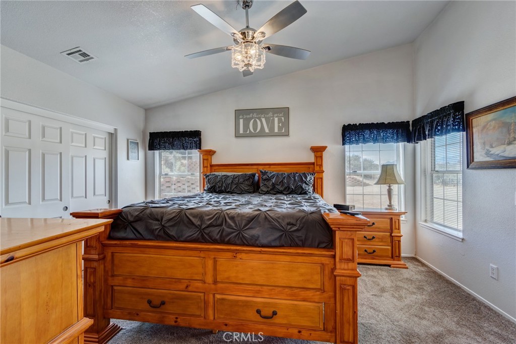 7170 Joshua Road Oak Hills, CA 92344 - Photo 38 of 58 a bedroom with a bed and window