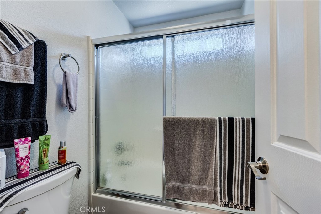7170 Joshua Road Oak Hills, CA 92344 - Photo 40 of 58 a bathroom with a shower and a sink
