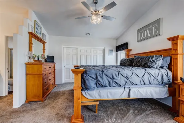 a bedroom with bed and window