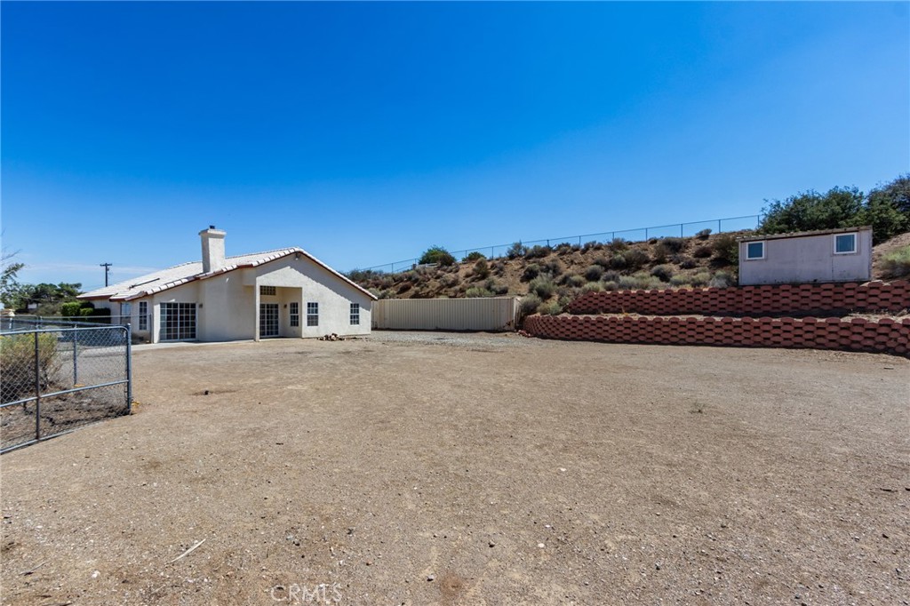 7170 Joshua Road Oak Hills, CA 92344 - Photo 57 of 58 a view of a house with a outdoor space