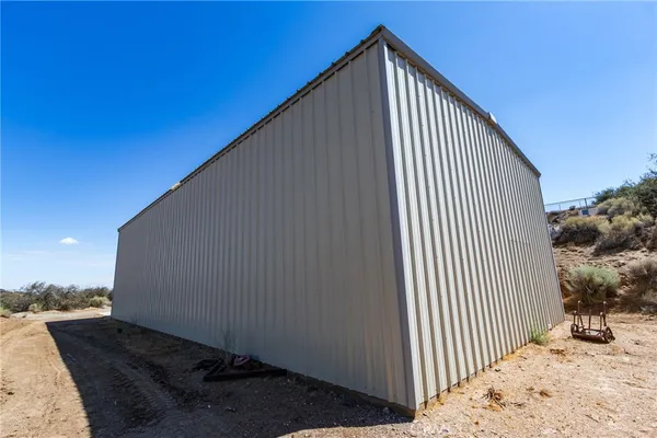 a bedroom with a bed and a night stand