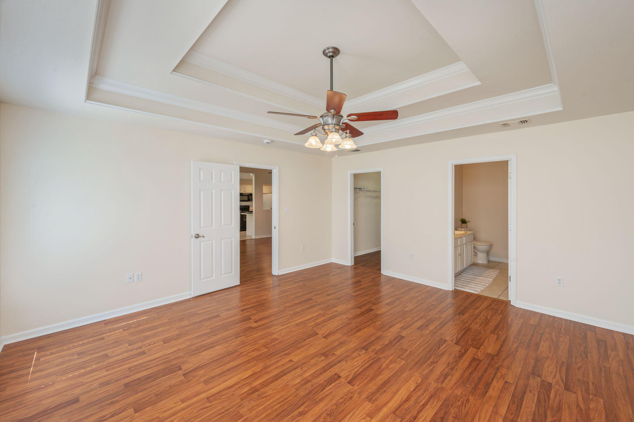 35 Lake Front Drive Miramar Beach, FL 32550 - Photo 14 of 29 a view of an empty room with wooden floor and a ceiling fan