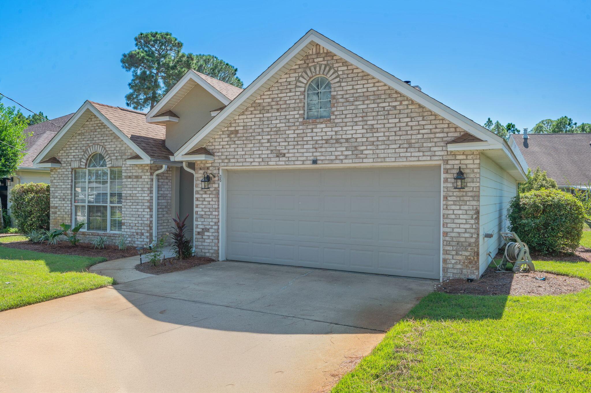 35 Lake Front Drive Miramar Beach, FL 32550 - Photo 2 of 29 a front view of a house with a yard