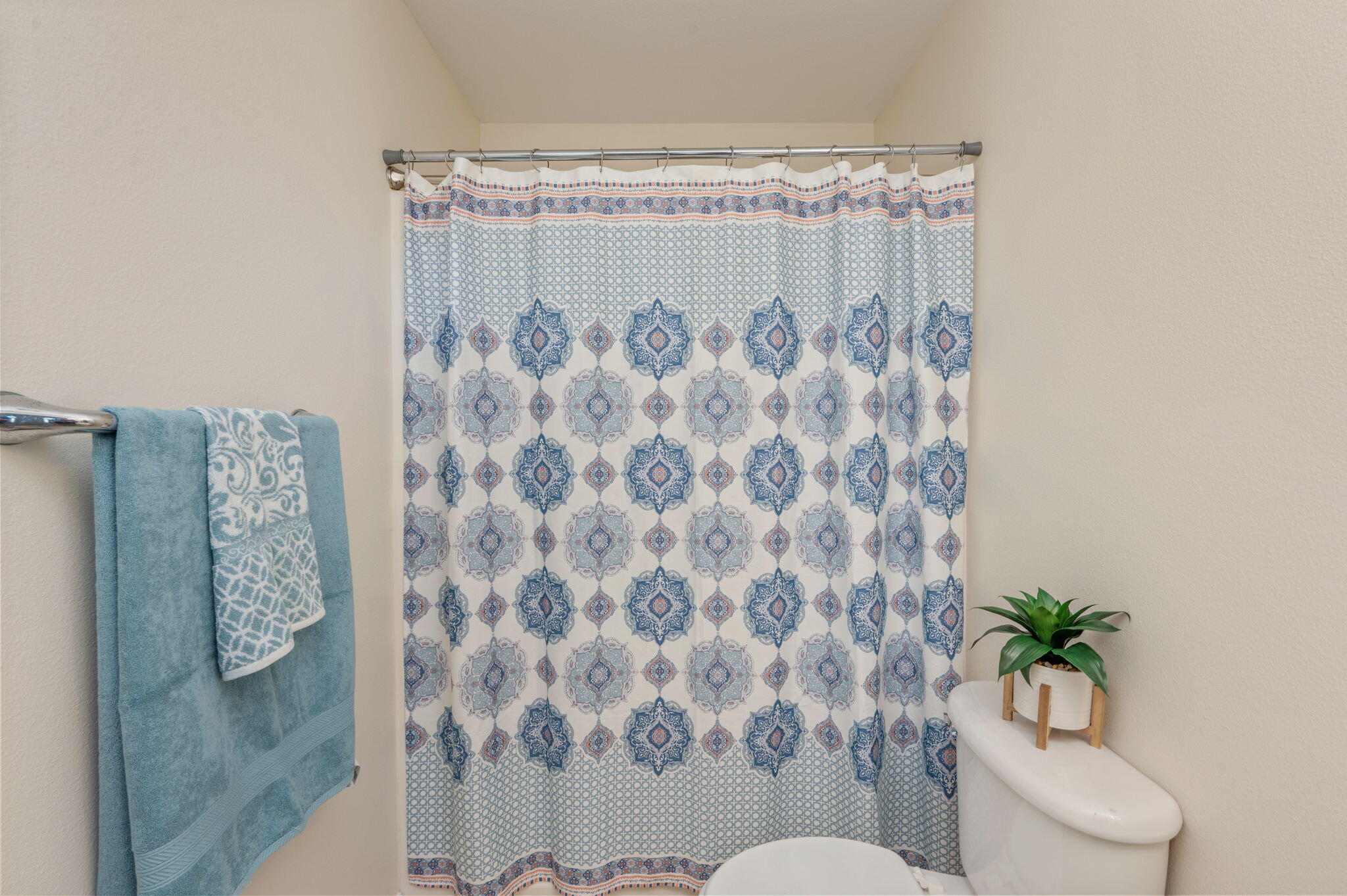 35 Lake Front Drive Miramar Beach, FL 32550 - Photo 24 of 29 a white toilet sitting next to a shower curtain