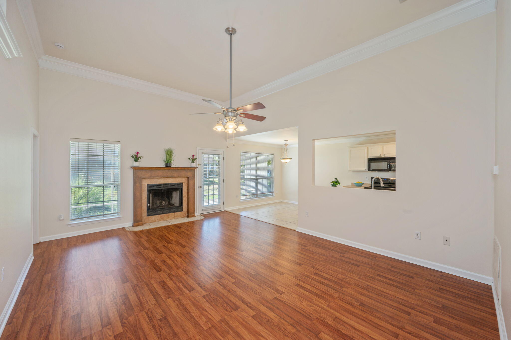 35 Lake Front Drive Miramar Beach, FL 32550 - Photo 5 of 29 a view of an empty room with wooden floor fireplace and a window