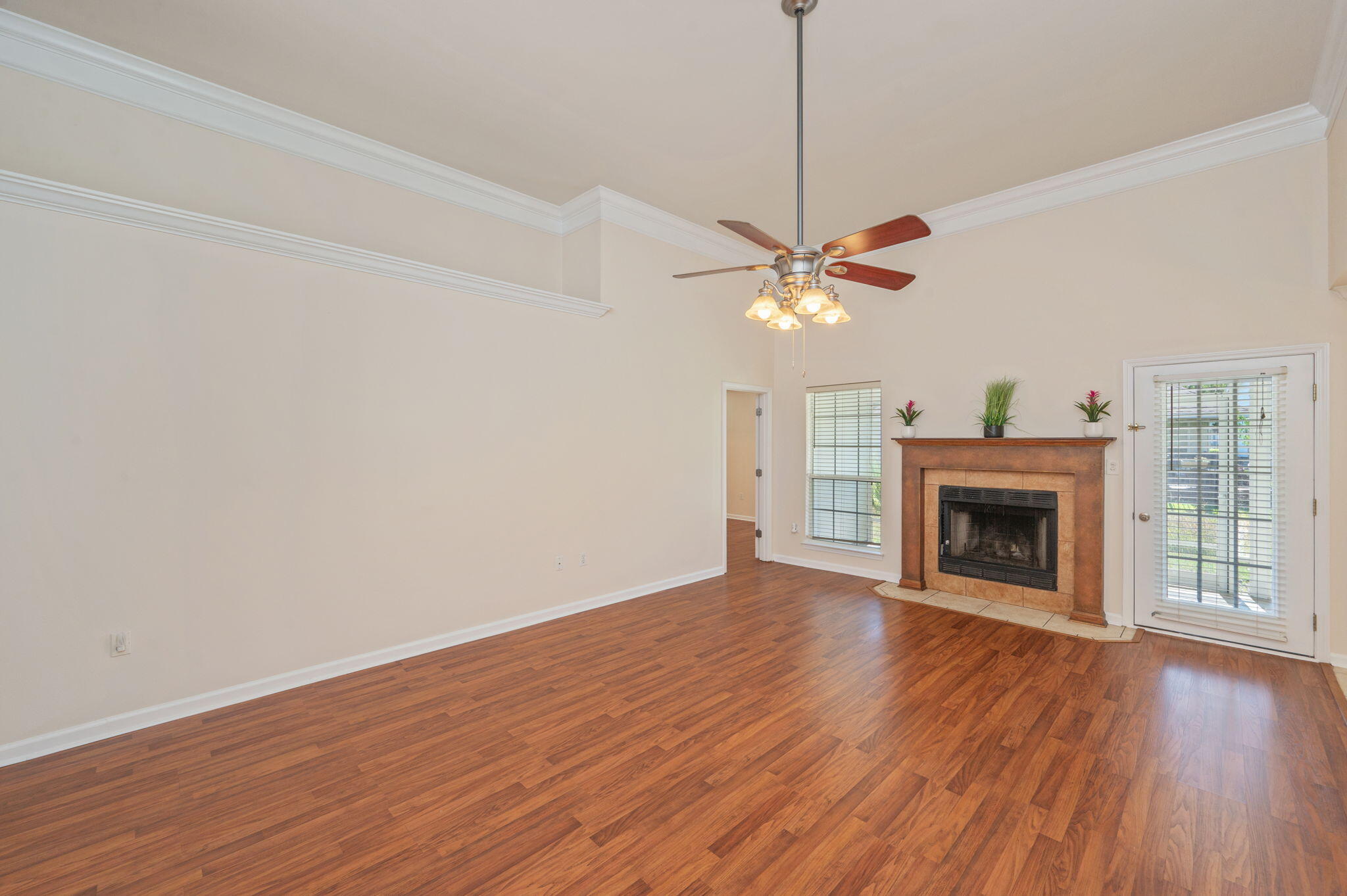 35 Lake Front Drive Miramar Beach, FL 32550 - Photo 6 of 29 a view of an empty room with wooden floor fireplace and a window
