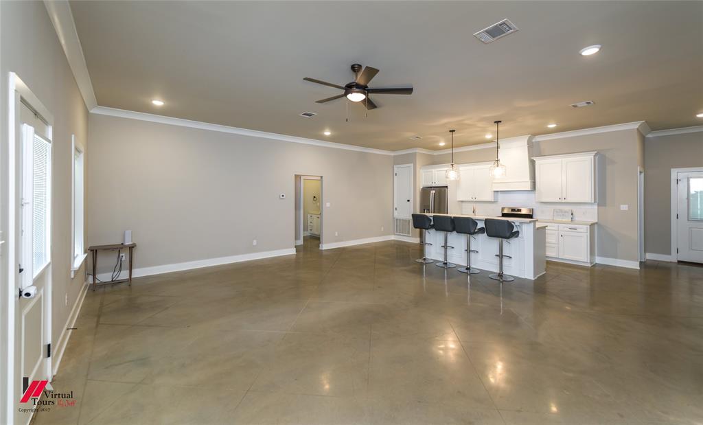 1320 Fuller Cemetery Road Minden, LA 71055 - Photo 14 of 40 Open-concept living space featuring polished concrete flooring, crown molding, and recessed lighting