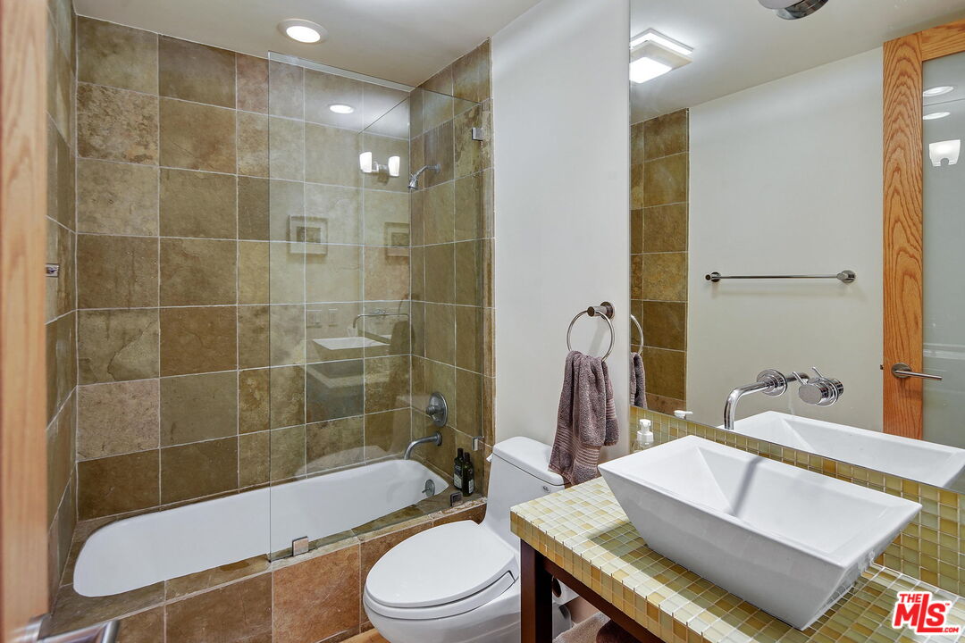 2 Ketch Street, Unit 102 Marina del Rey, CA 90292 - Photo 14 of 22 a bathroom with a sink a toilet and shower