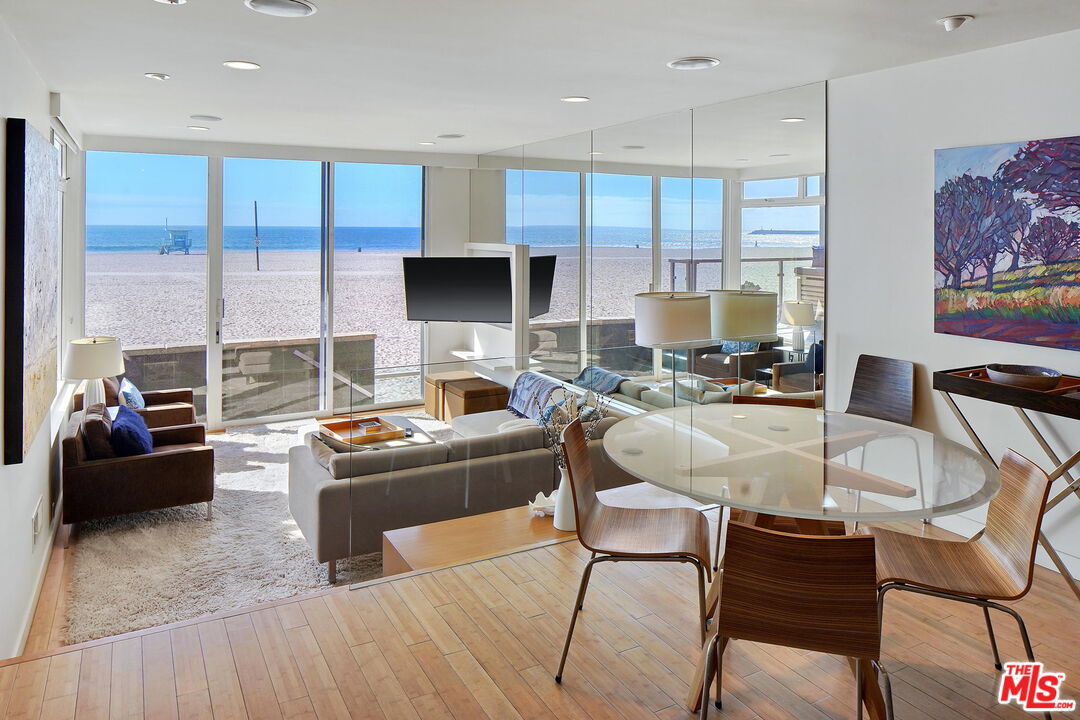 2 Ketch Street, Unit 102 Marina del Rey, CA 90292 - Photo 17 of 22 a living room with furniture and a large window