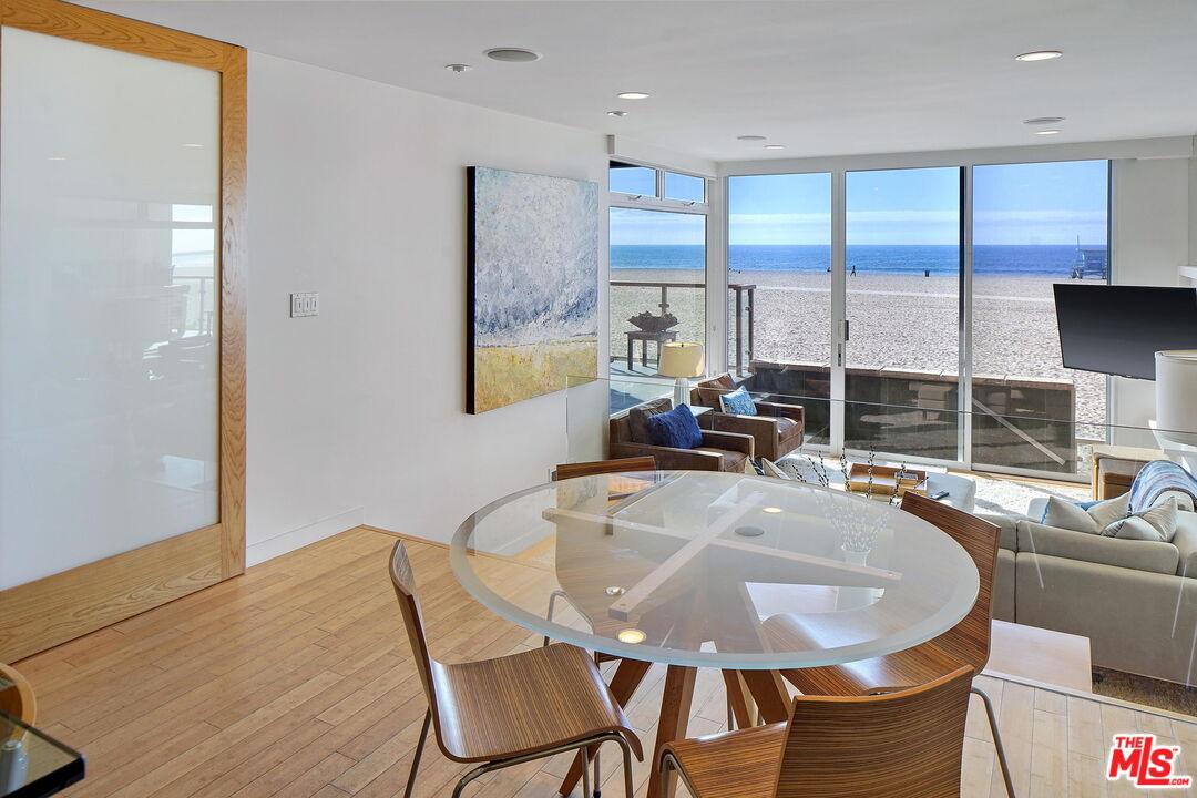 2 Ketch Street, Unit 102 Marina del Rey, CA 90292 - Photo 18 of 22 a dining room with furniture a window and a kitchen view